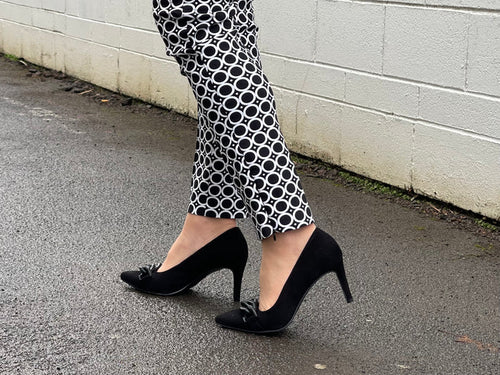 Comfortable, quality European women's stiletto sandal in suede leather. Quirky chain link detailing across the toe bar. Wedding or special occasion shoe in black.