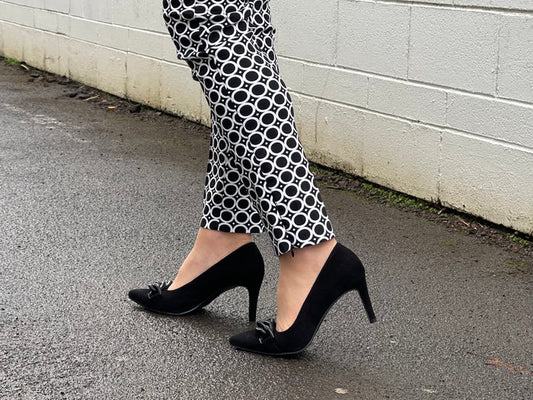 Comfortable, quality European women's stiletto sandal in suede leather. Quirky chain link detailing across the toe bar. Wedding or special occasion shoe in black.