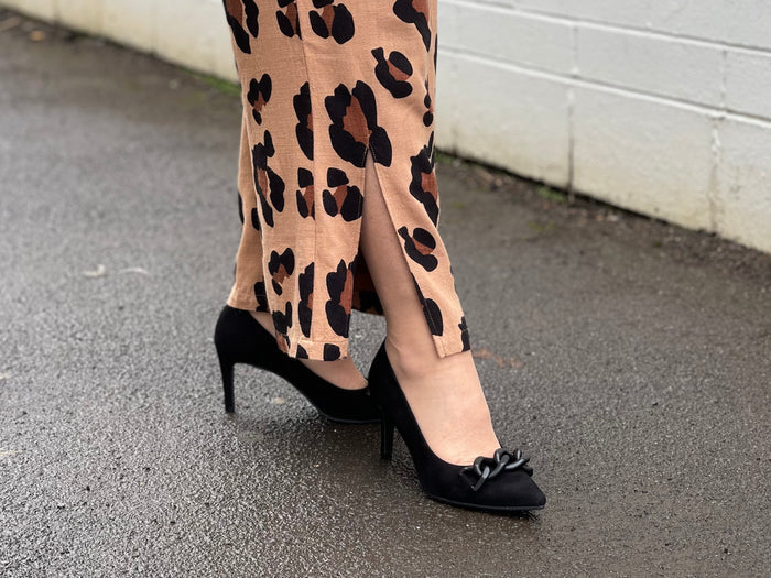 Comfortable, quality European women's stiletto sandal in suede leather. Quirky chain link detailing across the toe bar. Wedding or special occasion shoe in black.
