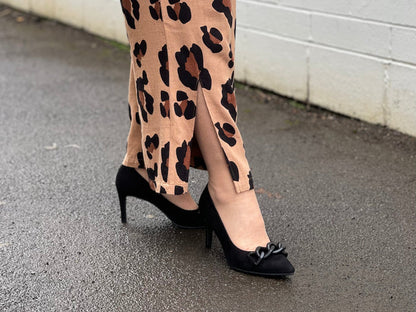 Comfortable, quality European women's stiletto sandal in suede leather. Quirky chain link detailing across the toe bar. Wedding or special occasion shoe in black.