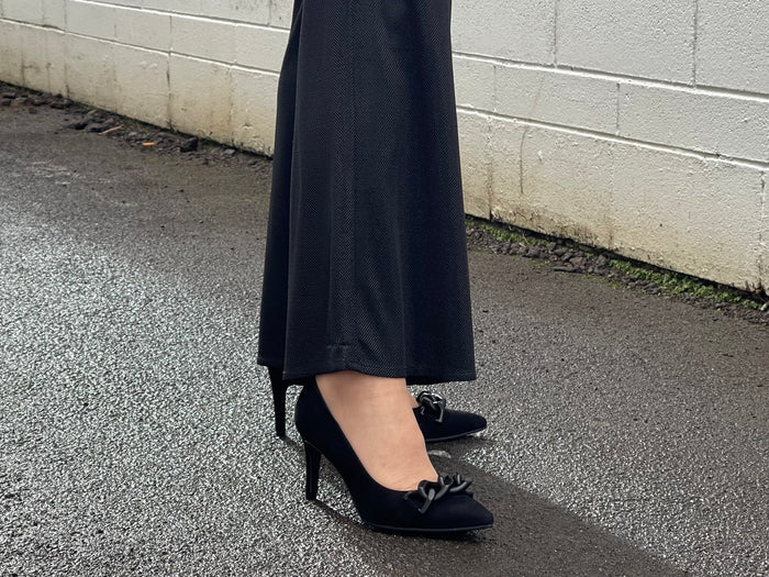 Comfortable, quality European women's stiletto sandal in suede leather. Quirky chain link detailing across the toe bar. Wedding or special occasion shoe in black.