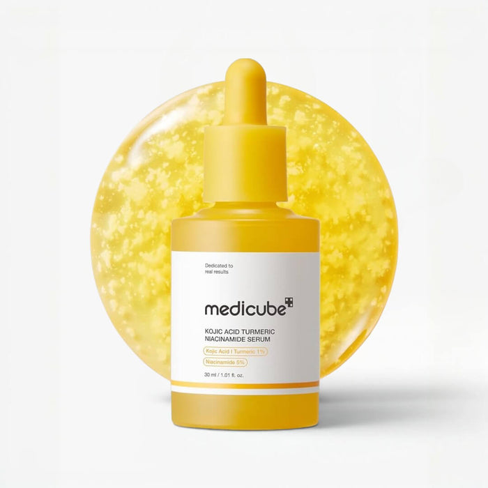 Medicube Kojic Acid Turmeric Niacinamide Serum 30ml in a yellow bottle with Snowflake Capsules background.