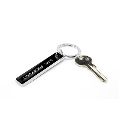 Mr. Perfect black enamel bar keychain with chrome split ring and key