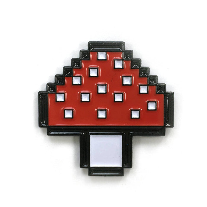 Kolorspun Pins mushroom-shaped magnetic golf ball marker on a golf green, designed for easy attachment and visibility.