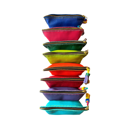 Stack of zippered Nora pen/glasses pouches in blue, red, green, and turquoise