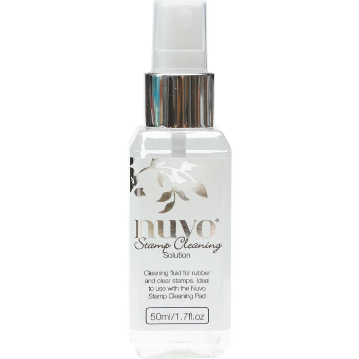 Nuvo - Stamp Cleaning Solution - 2oz. This cleaning solution cleans a variety of inks including pigment, hybrid and dye-based inks. Ideal for both rubber and clear stamps. This package contains 2oz of cleaning solution. Imported. Available at Embellish Away located in Bowmanville Ontario Canada.
