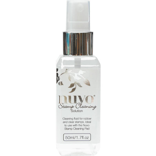 Nuvo - Stamp Cleaning Solution - 2oz. This cleaning solution cleans a variety of inks including pigment, hybrid and dye-based inks. Ideal for both rubber and clear stamps. This package contains 2oz of cleaning solution. Imported. Available at Embellish Away located in Bowmanville Ontario Canada.