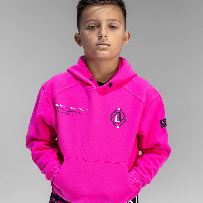 Child wearing pink hoodie with 'BL101 X OFF FIELD' logo on chest