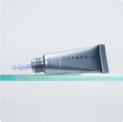 Cosmedix serum tube on a light gray background