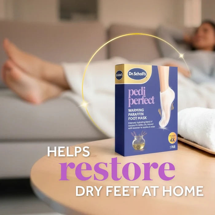 Warming paraffin foot mask package on table with feet covered by white booties