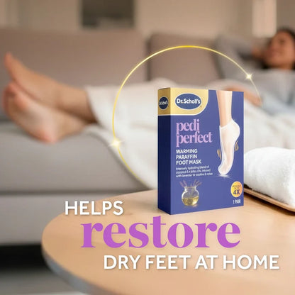 Warming paraffin foot mask package on table with feet covered by white booties
