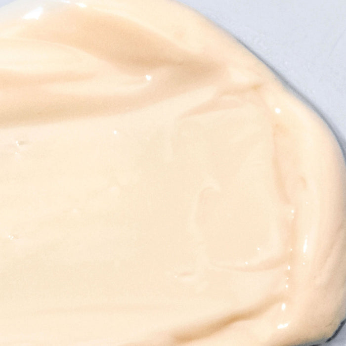 Peptide Rich Defense SPF 50 orange swatch against white background