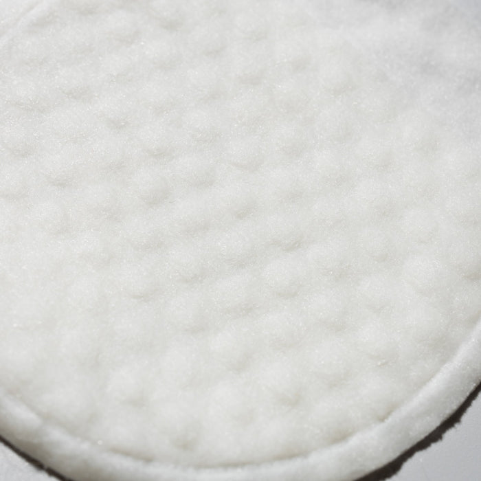 Close-up of soft white cottony pad material used in Prep & Reset exfoliating pads
