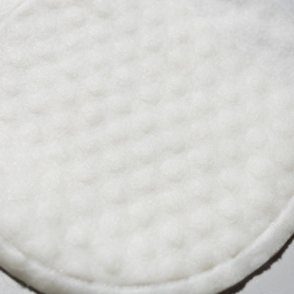 Close-up of soft white cottony pad material used in Prep & Reset exfoliating pads