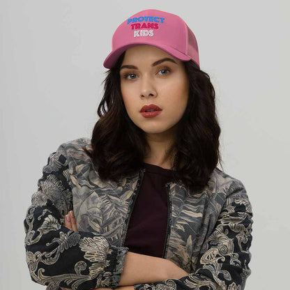Protect Trans Kids Trucker Mesh Snapback Hat pink on woman
