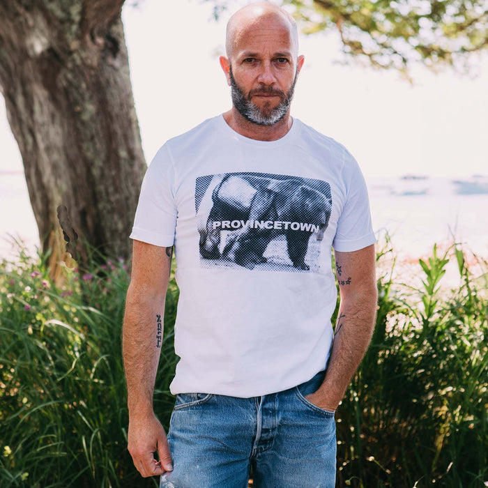 Adam Singer wearing white Naro Pinosa Provincetown bear t-shirt. Bear Week graphic tee from Adam's Nest, queer-owned boutique in Provincetown MA.