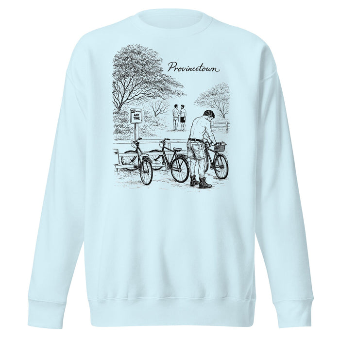 A light blue crewneck sweatshirt featuring a black line art graphic of a person with bicycles in a park, with the text 'Provincetown' printed above the illustration.