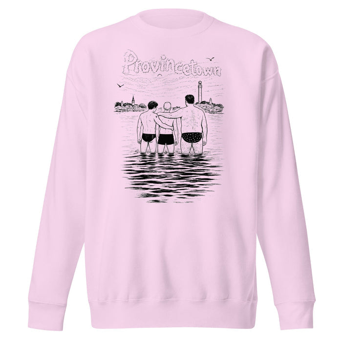 A light pink crewneck sweatshirt featuring a black line art graphic on the back. The graphic shows three men standing in water with their arms around each other, with the word 'Provincetown' written above in a stylized font, and a lighthouse in the background.