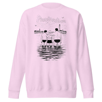 A light pink crewneck sweatshirt featuring a black line art graphic on the back. The graphic shows three men standing in water with their arms around each other, with the word 'Provincetown' written above in a stylized font, and a lighthouse in the background.