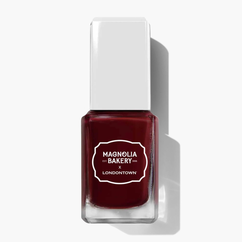 A bottle of rich, deep burgundy nail polish labeled “Red Velvet by LONDONTOWN” stands upright on a white background with a shadow to the right.