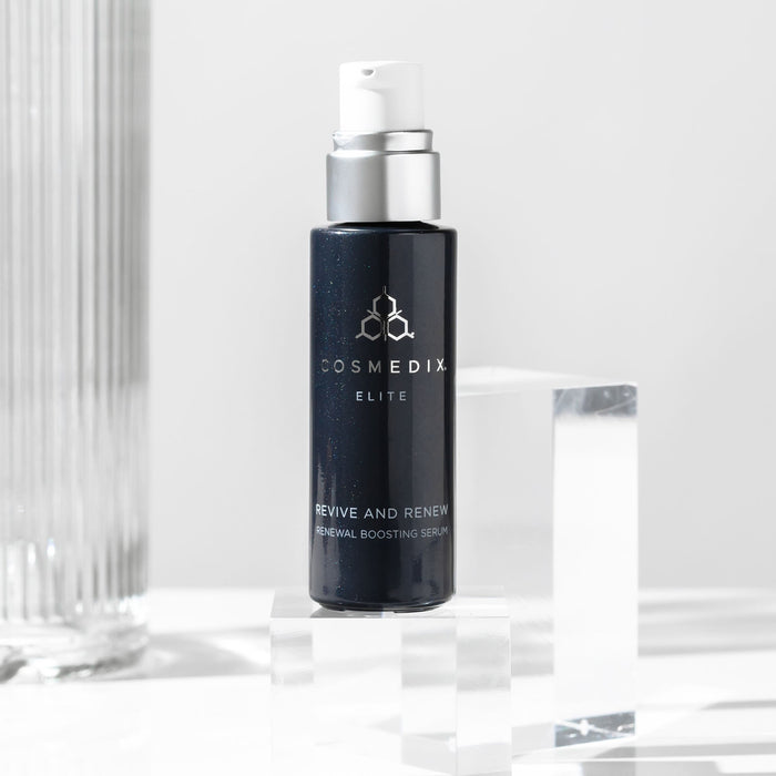 CosMedix Revive and Renew Renewal Boosting Serum bottle with white pump and silver collar on a light background