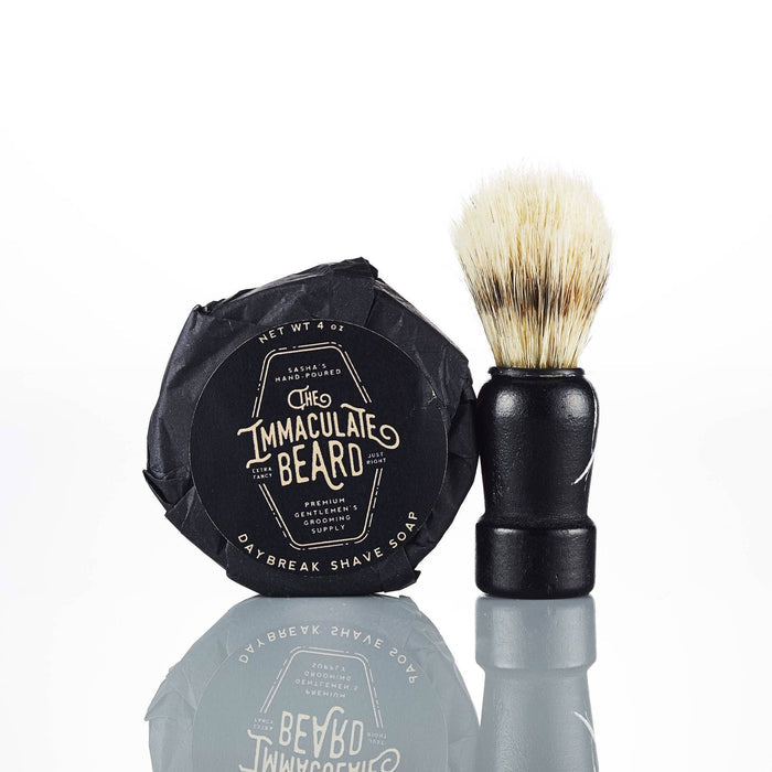 The Immaculate Beard shave soap puck with a smooth, round soap surface in a simple container for wet shaving.