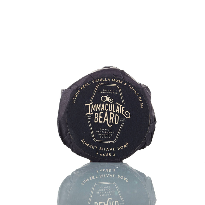 The Immaculate Beard shave soap puck with a smooth, round soap surface in a classic white color for a close, comfortable shave.