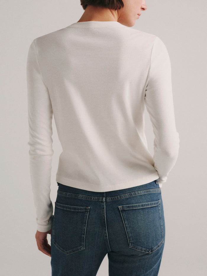 DL1961 Shrunken Tee long-sleeve in white, fitted crew-neck top with blue jeans, back view.