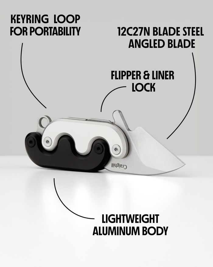 Mini folding knife with keyring loop, flipper/liner lock, angled blade open