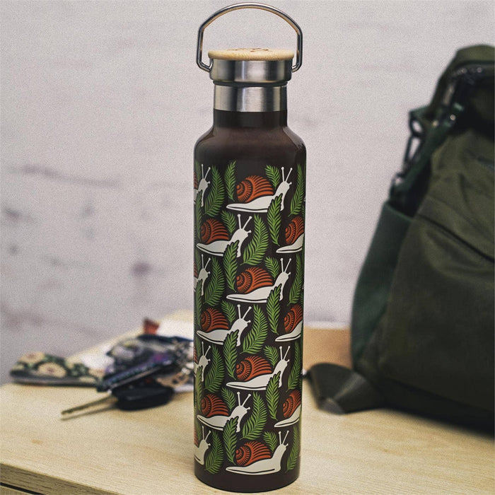 Questionables Snail Insulated Glass Bottle showing a clear glass design with a colorful snail illustration.