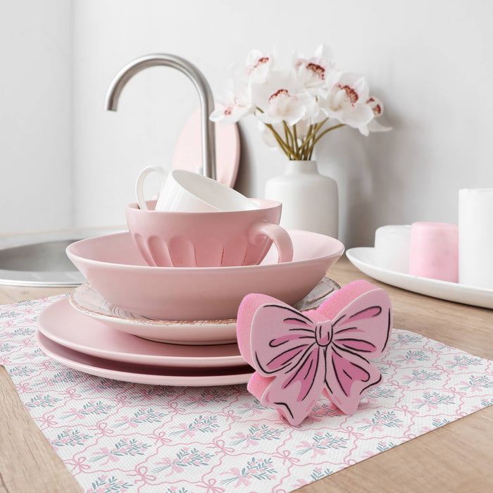 Set of two Fred & Friends TIDY TIES Coquette Bow Sponges with colorful, bow-shaped design for kitchen cleaning.