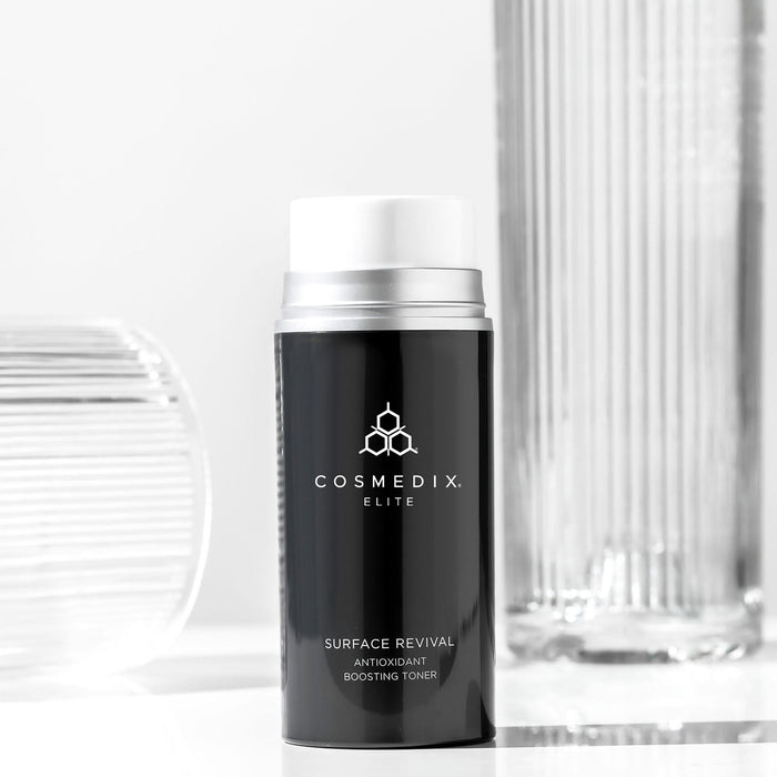 CosMedix Surface Revival Antioxidant Boosting Toner bottle with elite branding on dark label
