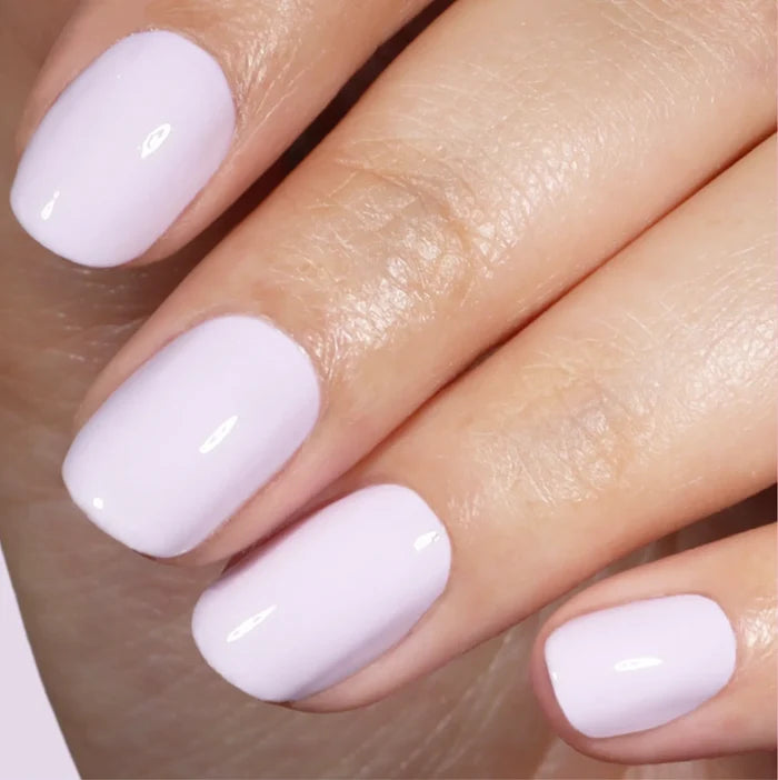 A close-up of a hand with neatly manicured nails painted in Sweet Dreams, a soothing pastel lavender shade by LONDONTOWN.