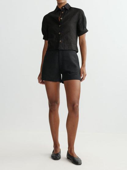 DL1961 women's Taylor Jean Short Ultra High-Rise shorts in black 'Black Linen', front view on model with matching shirt.