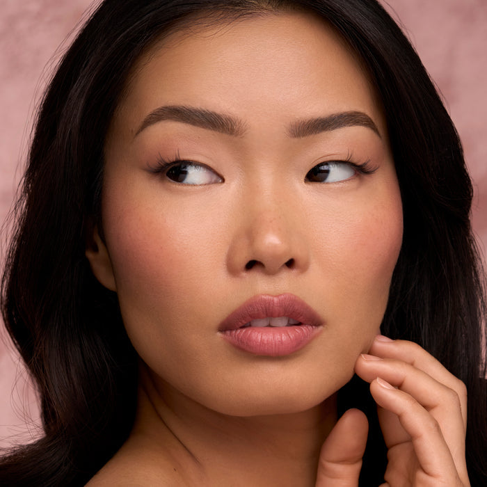Close up of a woman's eyes with long lashes from The Flirt Daily Lash Routine Set