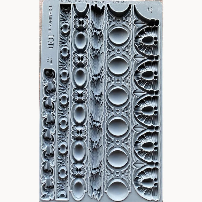 Decorative molding with intricate patterns on a white background