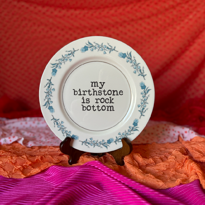 Upcycled funny plates featuring birthstone designs by Pretty Little Creeps, perfect as unique gift shop gifts.