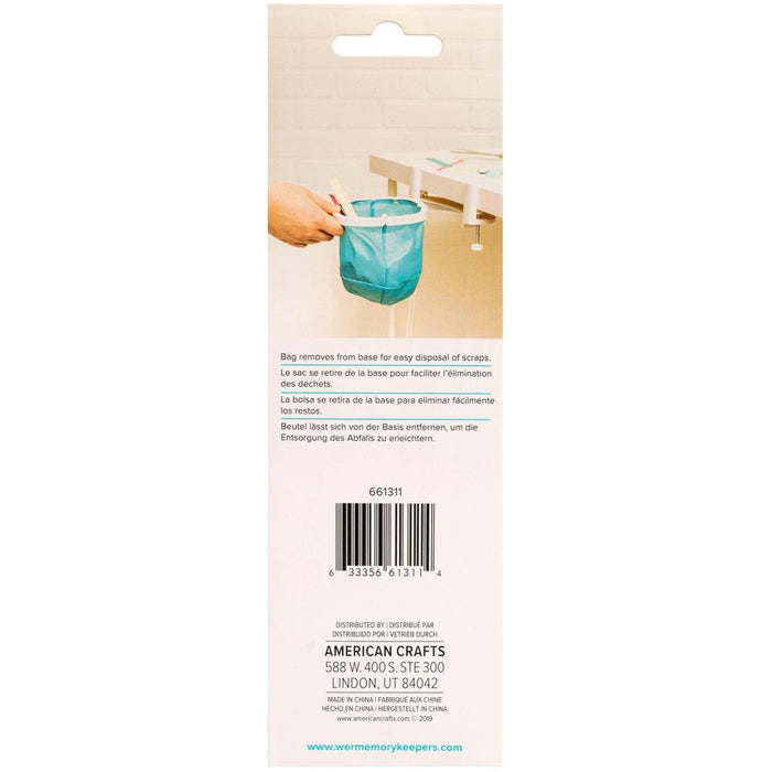 We R Memory Keepers - Desktop Dustbin. Keep your crafting space clean with the Desktop Dustbin from We R Memory Keepers. This handy little litter-catcher is perfect for decluttering after a long day of crafting. The adjustable clamps fit on most desks and work surfaces to accommodate any space, and this makes it easy to scoop and sweep up glitter and paper scraps from your work area. Available at Embellish Away located in Bowmanville Ontario Canada.