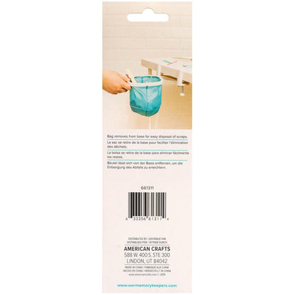 We R Memory Keepers - Desktop Dustbin. Keep your crafting space clean with the Desktop Dustbin from We R Memory Keepers. This handy little litter-catcher is perfect for decluttering after a long day of crafting. The adjustable clamps fit on most desks and work surfaces to accommodate any space, and this makes it easy to scoop and sweep up glitter and paper scraps from your work area. Available at Embellish Away located in Bowmanville Ontario Canada.
