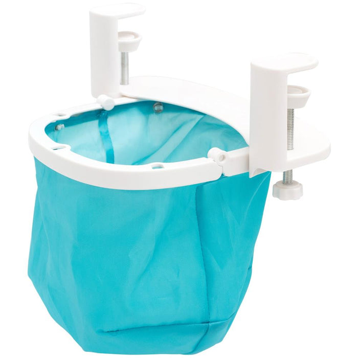 We R Memory Keepers - Desktop Dustbin. Keep your crafting space clean with the Desktop Dustbin from We R Memory Keepers. This handy little litter-catcher is perfect for decluttering after a long day of crafting. The adjustable clamps fit on most desks and work surfaces to accommodate any space, and this makes it easy to scoop and sweep up glitter and paper scraps from your work area. Available at Embellish Away located in Bowmanville Ontario Canada.